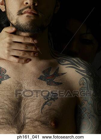 Stock Image - Hand on man's throat. Fotosearch