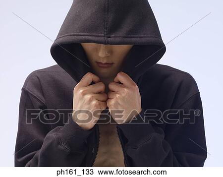 Man wearing a hooded jacket, face covered View Large Photo Image Stock Image - Man wearing a hooded jacket, face covered. Fotosearch