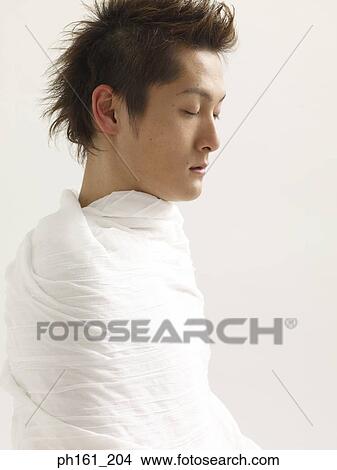 Picture - Man wrapped in white cloth. Fotosearch