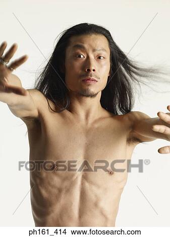 Shirtless young man with hands stretched out View Large Photo Image Picture - Shirtless young man with hands stretched out. Fotosearch