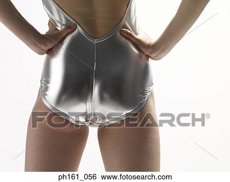 Woman in a silver swimsuit, back view View Large Photo Image Stock Photograph - Woman in a silver swimsuit, back view. Fotosearch