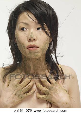 Woman with muddy hands and face View Large Photo Image Stock Photo - Woman with muddy hands and face. Fotosearch