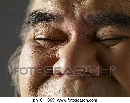 Stock Photo - Close-up of a mature man with eyes closed. Fotosearch
