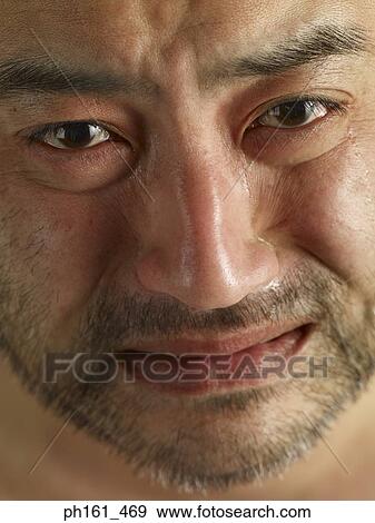 Stock Photo - Close-up of mature man, crying. Fotosearch