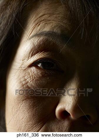 Close-up of mature woman's eyes View Large Photo Image Stock Photograph - Close-up of mature woman's eyes. Fotosearch