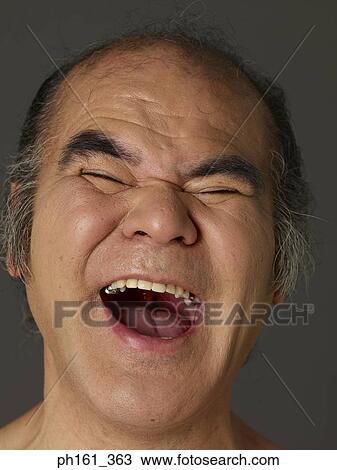 Mature man making a face, close-up View Large Photo Image Stock Image - Mature man making a face, close-up. Fotosearch