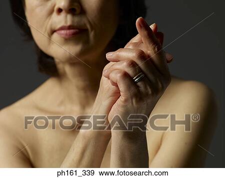 Portrait of mature woman with hands together View Large Photo Image Stock Photo - Portrait of mature woman with hands together. Fotosearch