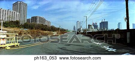 Empty road with buildings on the side View Large Photo Image Stock Image - Empty road with buildings on the side. Fotosearch