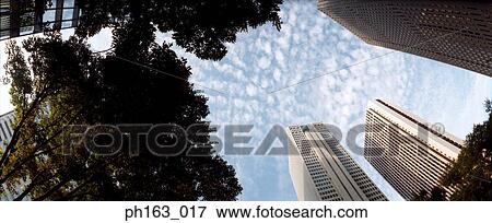 Stock Photo - Tall office buildings, low angle view. Fotosearch