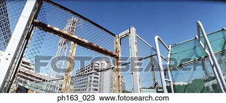 View of rusty fence and gate View Large Photo Image Stock Image - View of rusty fence and gate. Fotosearch