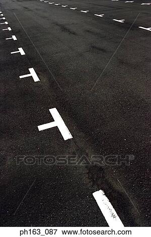 An empty parking lot View Large Photo Image Stock Photo - An empty parking lot. Fotosearch