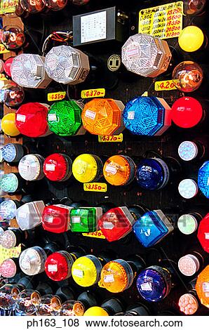 Stock Photo - Different light bulbs on a wall panel. Fotosearch