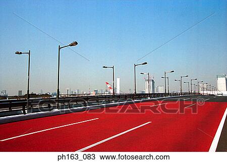 Highway with red road View Large Photo Image Stock Image - Highway with red road. Fotosearch