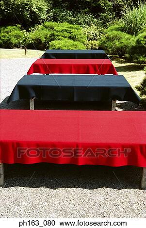 Tables with table cloths in the garden View Large Photo Image Stock Image - Tables with table cloths in the garden. Fotosearch