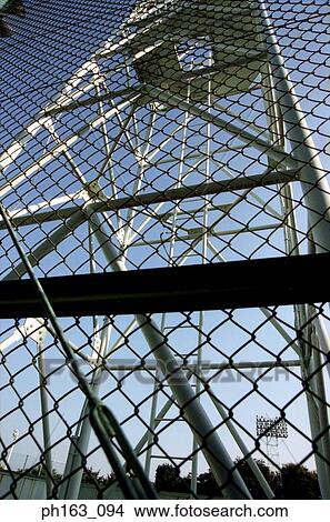 Tall tower behind a fence View Large Photo Image Picture - Tall tower behind a fence. Fotosearch