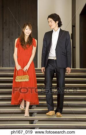 Couple walking down stairs View Large Photo Image Stock Photo - Couple walking down stairs. Fotosearch