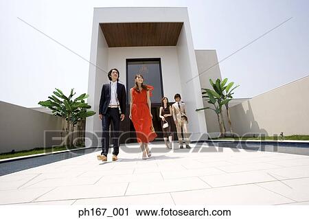 Two couples in stylish clothes, walking outdoors, low angle View Large Photo Image Stock Image - Two couples in stylish clothes, walking outdoors, low angle. Fotosearch