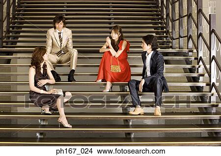 Two couples sitting on steps View Large Photo Image Picture - Two couples sitting on steps. Fotosearch