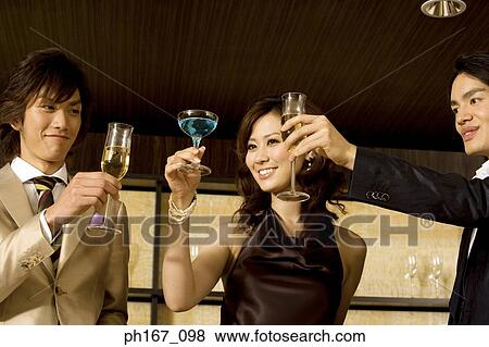 Two men and a woman relaxing by the bar View Large Photo Image Stock Photo - Two men and a woman relaxing by the bar. Fotosearch