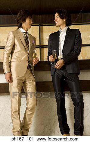 Stock Image - Two men relaxing by the bar. Fotosearch