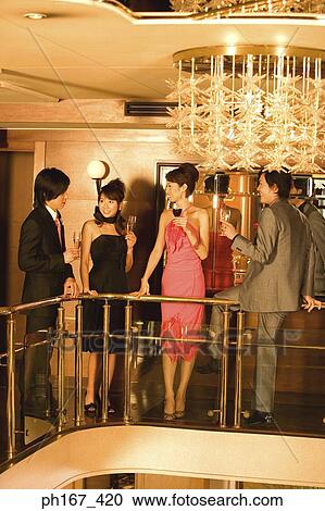 Two couples relaxing in the bar off cruise ship View Large Photo Image Stock Image - Two couples relaxing in the bar off cruise ship. Fotosearch