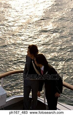 Two men enjoying the view onboard a cruise ship, high angle view View Large Photo Image Stock Image - Two men enjoying the view onboard a cruise ship, high angle view. Fotosearch