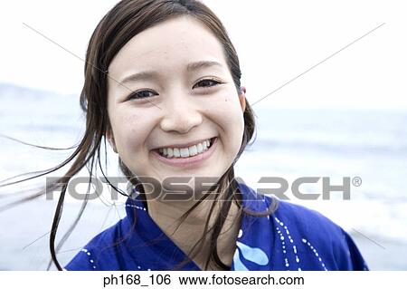 Portrait of a young woman, close-up View Large Photo Image Stock Photograph - Portrait of a young woman, close-up. Fotosearch