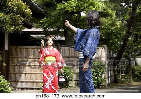 Couple in traditional Japanese clothing playing games View Large Photo Image Stock Image - Couple in traditional Japanese clothing playing games. Fotosearch