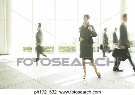 Group of executives at office lobby View Large Photo Image Stock Image - Group of executives at office lobby. Fotosearch