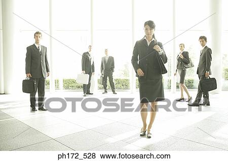 Group of executives at office lobby View Large Photo Image Stock Photo - Group of executives at office lobby. Fotosearch