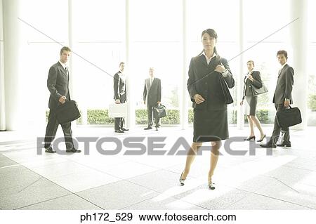 Group of executives at office lobby View Large Photo Image Stock Photo - Group of executives at office lobby. Fotosearch