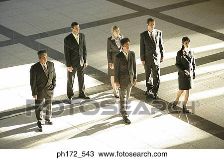 Group of executives standing in lobby View Large Photo Image Stock Image - Group of executives standing in lobby. Fotosearch