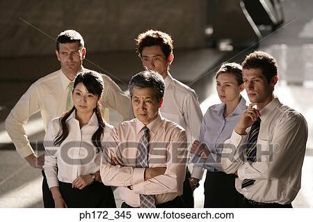 Group of executives standing inside building, high angle view View Large Photo Image Stock Photography - Group of executives standing inside building, high angle view. Fotosearch