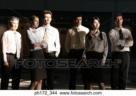 Picture - Group of executives standing . Fotosearch