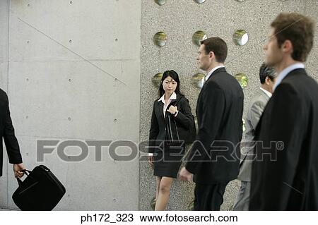 Group of executives walking View Large Photo Image Stock Image - Group of executives walking. Fotosearch