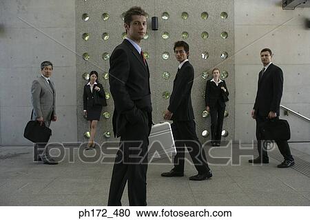 Group of executives walking View Large Photo Image Stock Image - Group of executives walking. Fotosearch