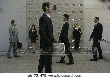 Group of executives walking View Large Photo Image Stock Photo - Group of executives walking. Fotosearch