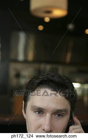 Portrait of businessman using mobile phone View Large Photo Image Picture - Portrait of businessman using mobile phone. Fotosearch