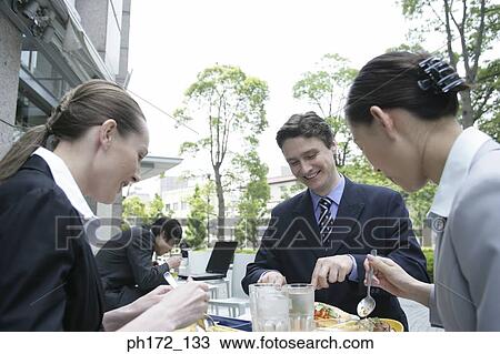 A group of executives having lunch View Large Photo Image Stock Image - A group of executives having lunch. Fotosearch