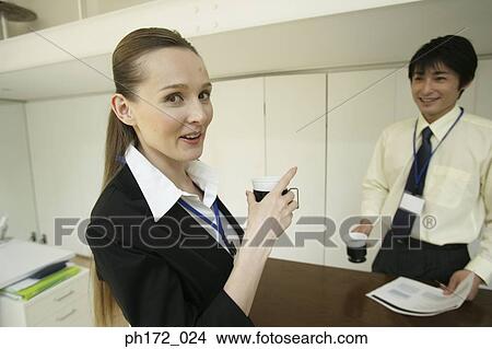 Picture - Businessman and female colleagues having coffee. Fotosearch