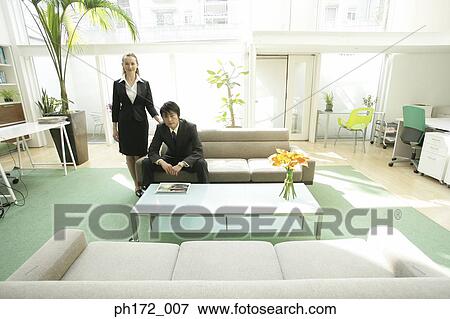 Discussion between businessman and businesswoman View Large Photo Image Stock Photo - Discussion between businessman and businesswoman. Fotosearch