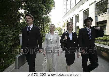 Group of executives walking View Large Photo Image Stock Image - Group of executives walking. Fotosearch