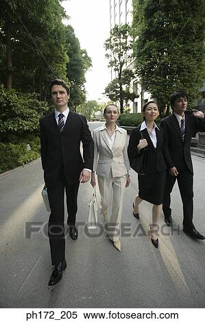 Stock Photography - Group of executives walking. Fotosearch