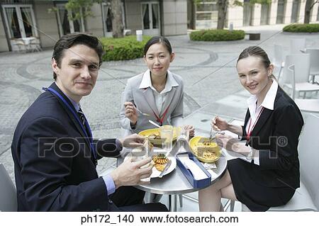Three executives having lunch View Large Photo Image Stock Image - Three executives having lunch. Fotosearch