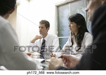Group of executives having a discussion View Large Photo Image Stock Photo - Group of executives having a discussion. Fotosearch