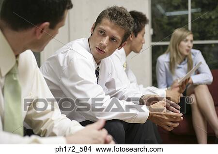 Picture - Group of executives having discussion. Fotosearch