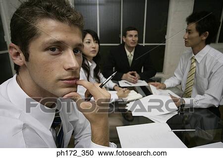 Group of executives in a meeting View Large Photo Image Stock Image - Group of executives in a meeting. Fotosearch