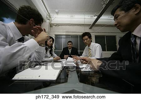 Stock Photo - Group of executives in a meeting. Fotosearch