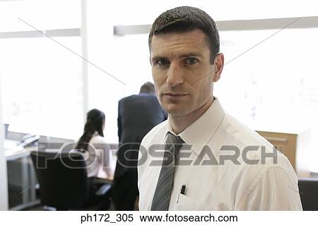 Mature executive standing in office View Large Photo Image Stock Photography - Mature executive standing in office. Fotosearch