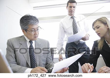Three executives in a meeting View Large Photo Image Stock Photo - Three executives in a meeting. Fotosearch